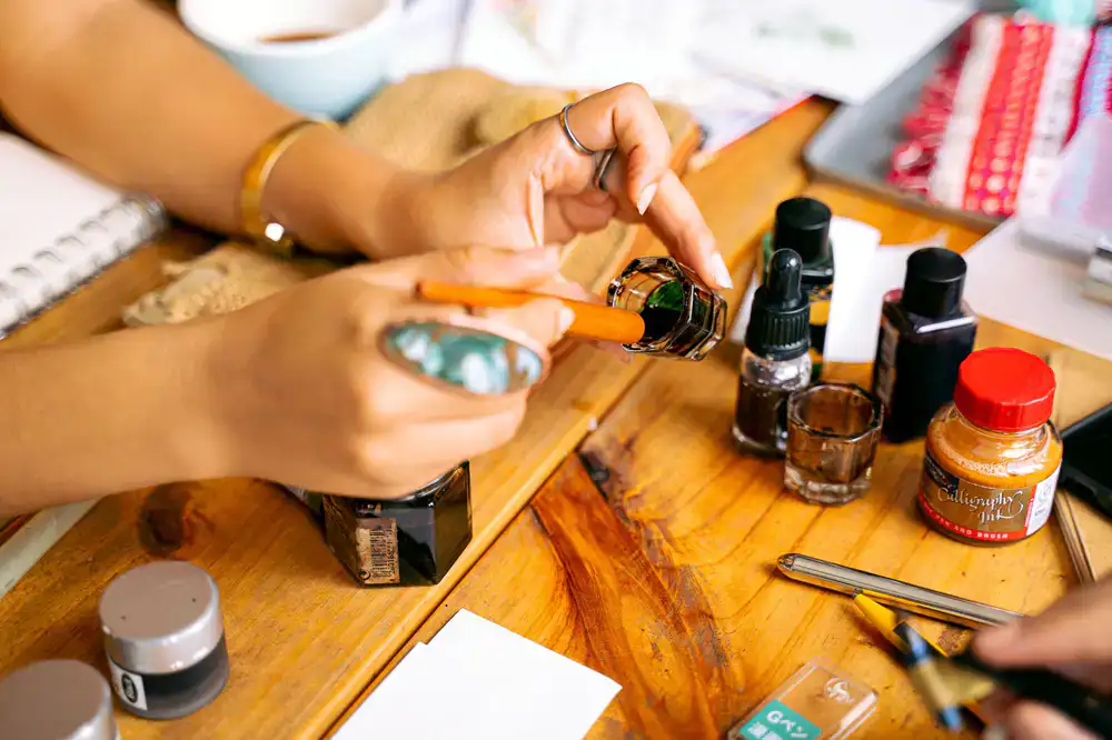 Studio blend artisanal calligraphy inks in glass bottles