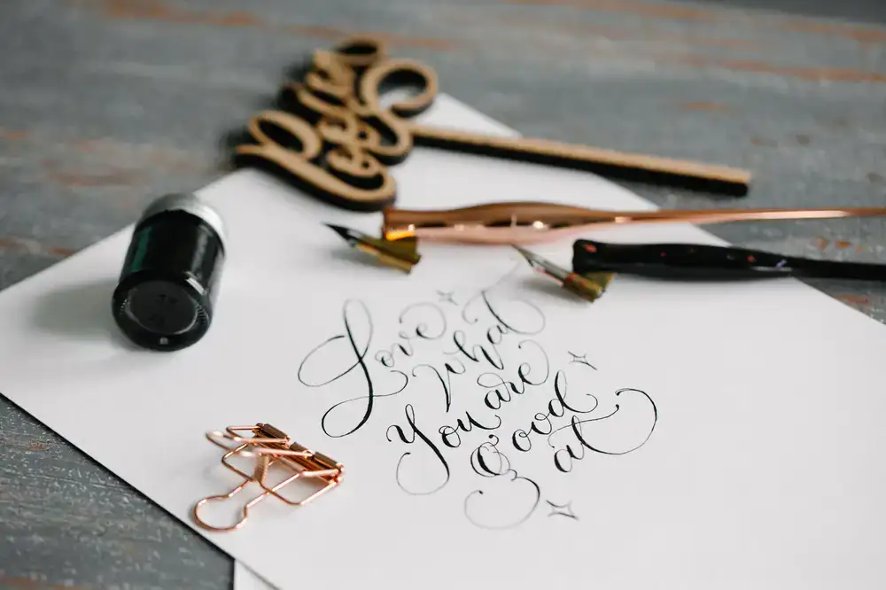 Beginner's Calligraphy Kit with pen, ink, and workbook
